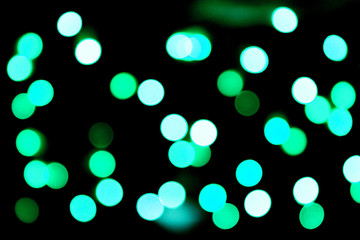 Unfocused abstract colourful bokeh black background. defocused and blurred many round blue light
