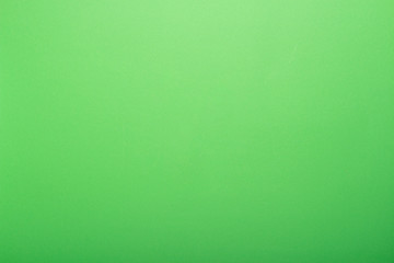Green cardboard background. Flat lay, top view