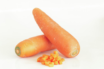 Fresh carrot and cut pieces isolated on white background