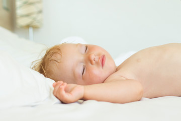 Sleeping baby in bed. The concept of a good and sound baby sleep