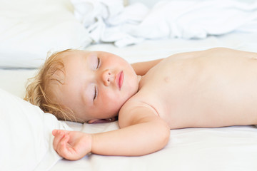 Sleeping baby in bed. The concept of a good and sound baby sleep