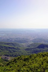 Obraz premium Foggy aerial view of Tirana, Albania. Tirana city seen from the Dajti Mountain (Dajti Mount). Beautiful cityscape seen from the Dajti Express cable car.