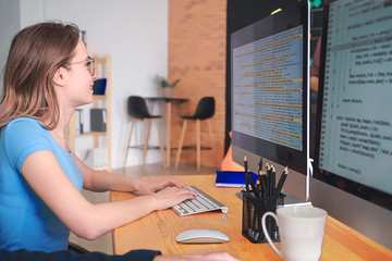 Female programmer working in office