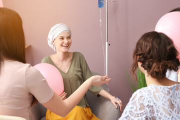 Women visiting her friend after chemotherapy at home