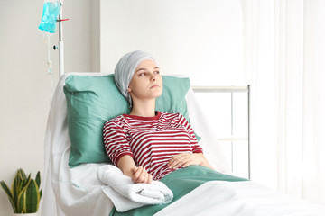 Young woman undergoing chemical therapy course in clinic