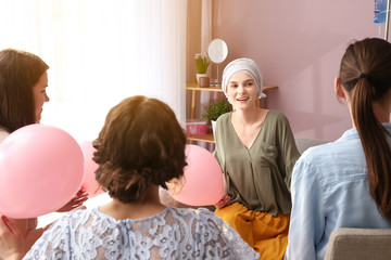 Women visiting her friend after chemotherapy at home