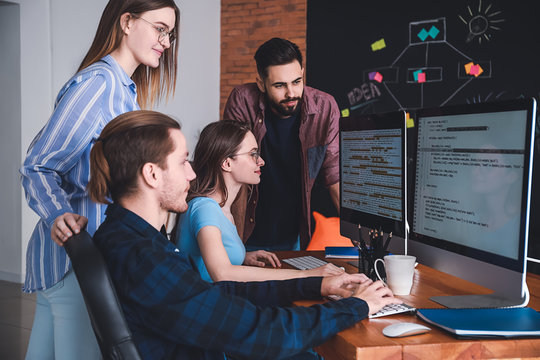 Team of programmers working in office