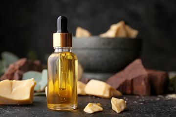 Cocoa butter oil on dark table