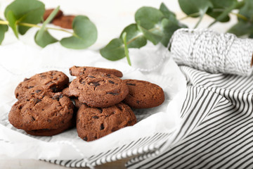 Tasty chocolate cookies on table