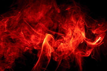 Red smoke on black background
