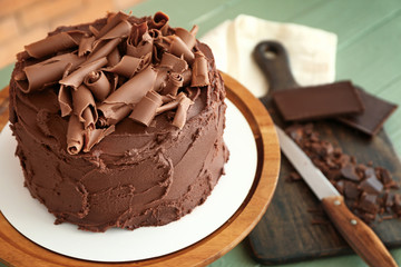Tasty chocolate cake on stand