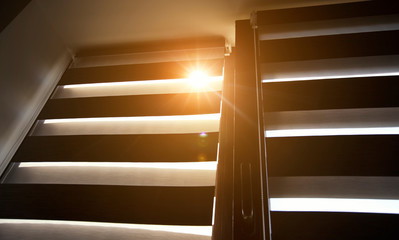 Sunlight enters the room through the blinds