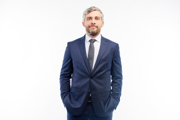Foreman in a suit looking at the camera on a white background