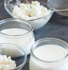 Fermented drink kefir in small bottles and kefir grains