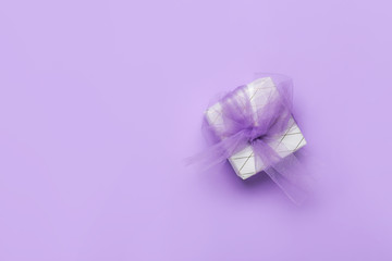 Beautiful gift box on color background