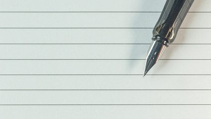 silver pen on wood table for business  content..