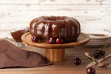Dessert stand with tasty chocolate cake on table