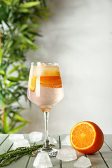 Glass of tasty summer cocktail on table