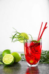 Glass of tasty summer cocktail on table