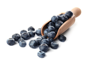 Ripe blueberry and scoop on white background