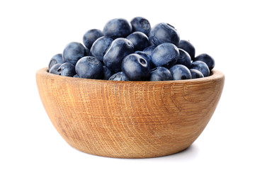 Bowl with ripe blueberry on white background