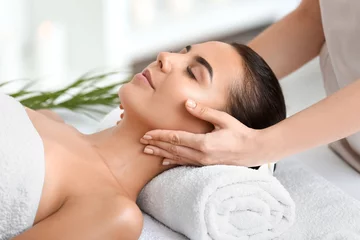 Foto auf Glas Beautiful young woman receiving massage in spa salon © Pixel-Shot