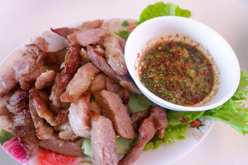 roasted pork slice white plate and chilli sauce thai style food asian