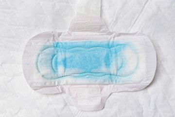 Sanitary napkin or feminine sanitary pad with blue water testing for Absorb water  - Female hygiene means women Period Product absorbent sheets