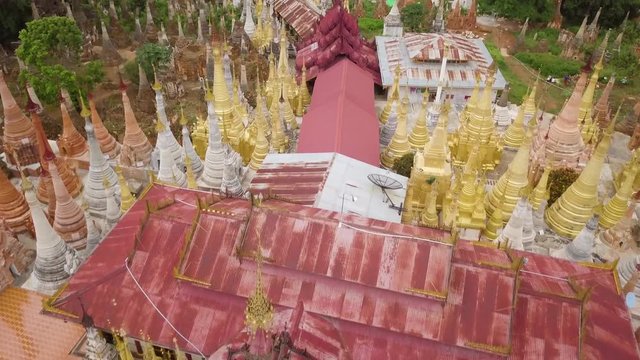 Aerial Flyby of the Inn Tain Pagoda at Inle Lake, Myanmar (Burma) Revealing the Landscape