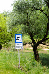 Bathing area for dogs sign next to river where dogs are allowed to go swimming, Croatia