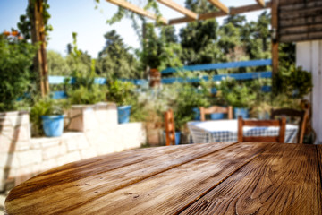 Desk of free space and summer background of garden 