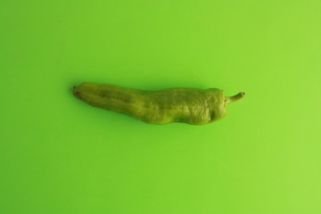 green pepper on colorful background