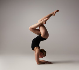 Beautifull flexible blonde girl posing. Gymnastics. 