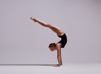 Beautifull flexible blonde girl posing. Gymnastics. 