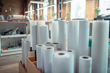 Rolls of paper for printing books standing in the office