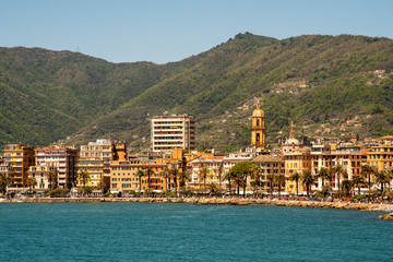 View of the coastal city of Rapallo in the Ligurian Riviera with the promenade, the bell tower of...