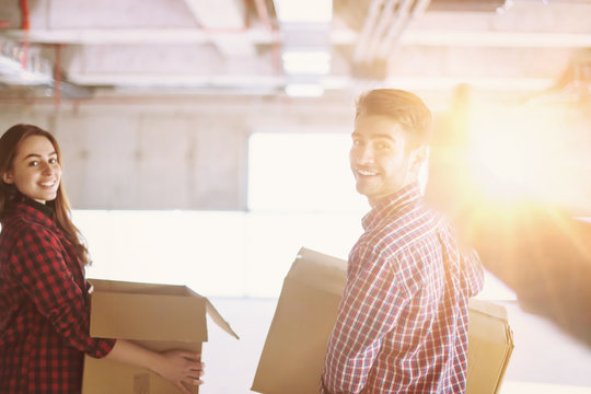 business team carrying cardboard boxes