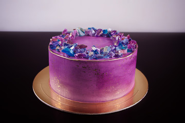 Violet cake with marmalade as amethysts trendy decor for cake
