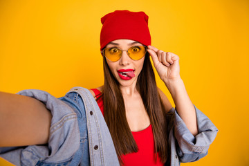 Close up photo of cute trendy teen make faces grimacing touch eyewear eyeglasses isolated over yellow background