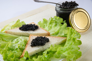 Sandwiches with black caviar