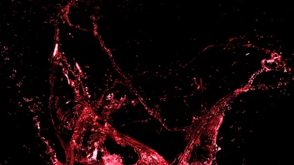 Foto op Canvas Abstract red wine splash shape on black background © Jag_cz