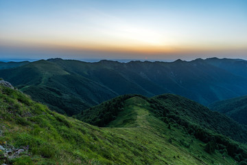 Mountain valley during sunrise. Natural summer landscape