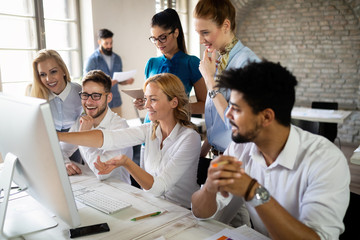 Creative business people working on business project in office