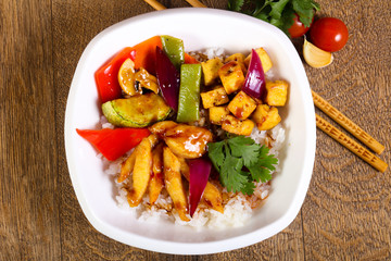 Wok with rice, cheese and tofu