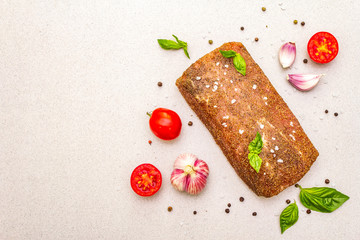 Raw pork loin with vegetables, species and herbs