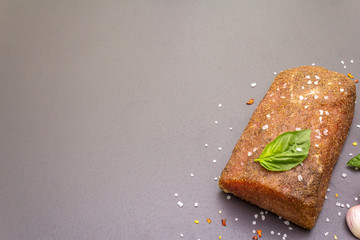 Raw pork loin with vegetables, species and herbs