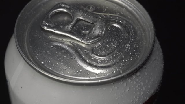 Water splashes fall on a white tin can
