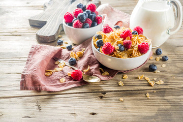 Healthy Corn Flakes for Breakfast with Milk and fresh summer berries