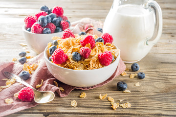 Healthy Corn Flakes for Breakfast with Milk and fresh summer berries