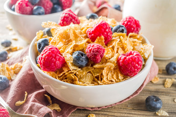 Healthy Corn Flakes for Breakfast with Milk and fresh summer berries